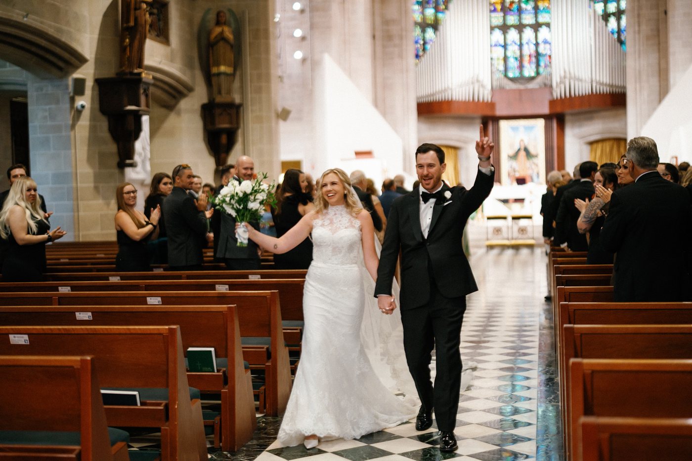 Couple walking through the church, after editing; photograph by Michele Maloney