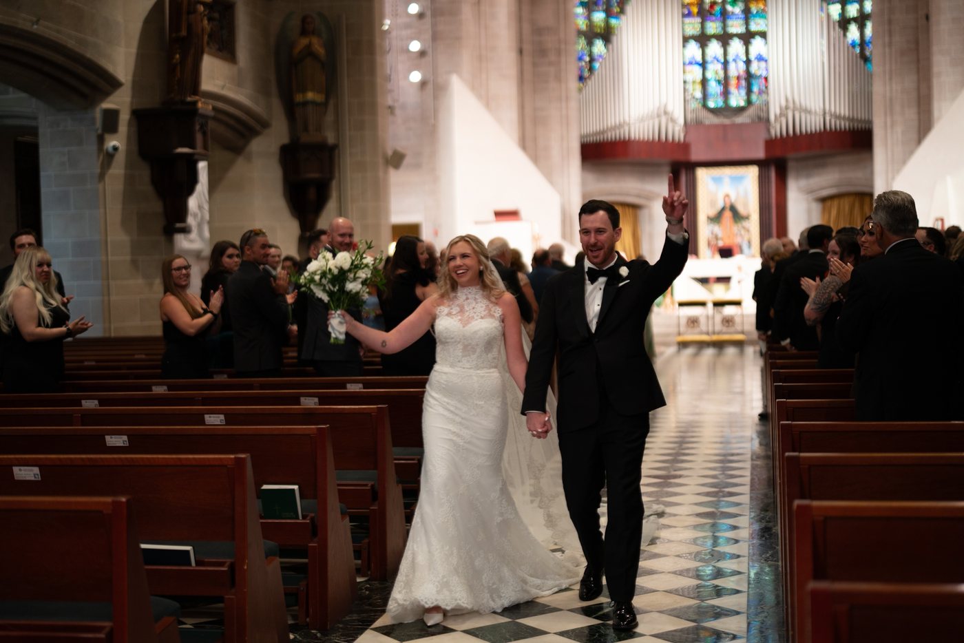 Couple walking through the church, before editing; photograph by Michele Maloney