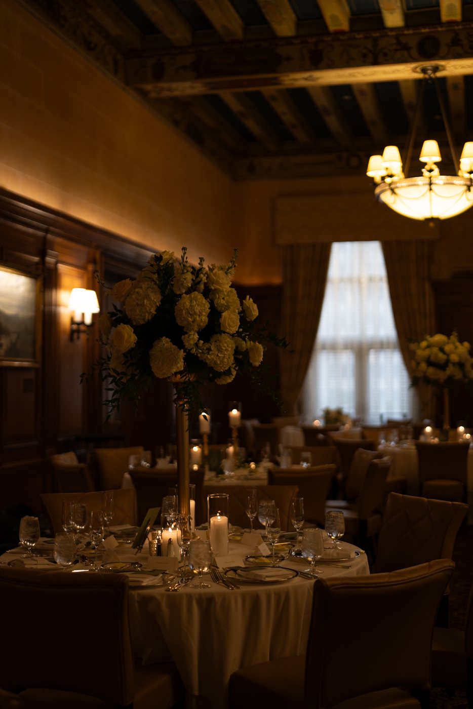 Flowers and place settings at the reception, before editing; photograph by Michele Maloney