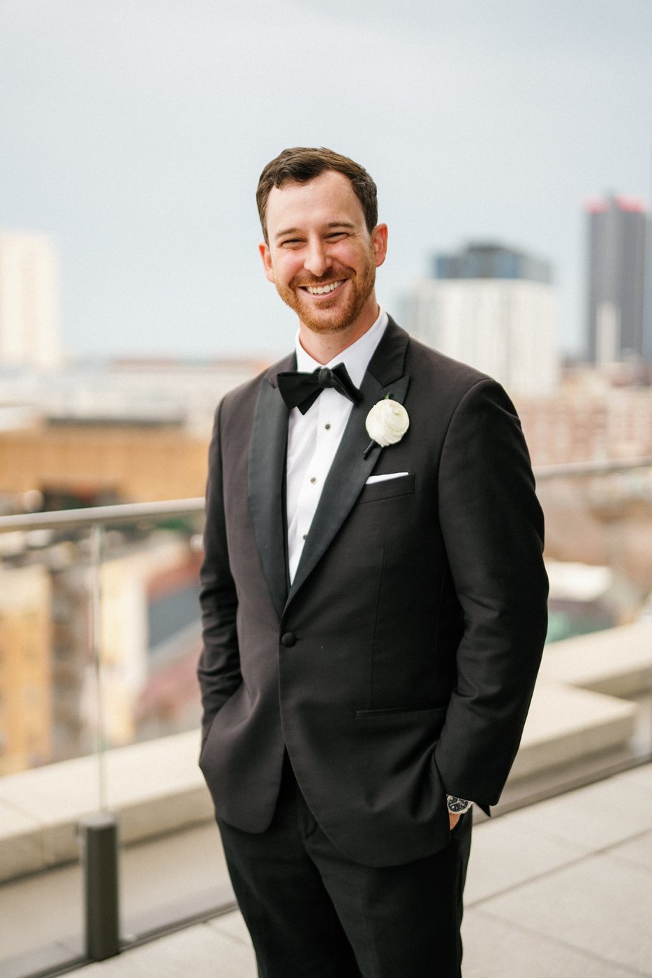 Groom in a rooftop portrait, after editing; photograph by Michele Maloney