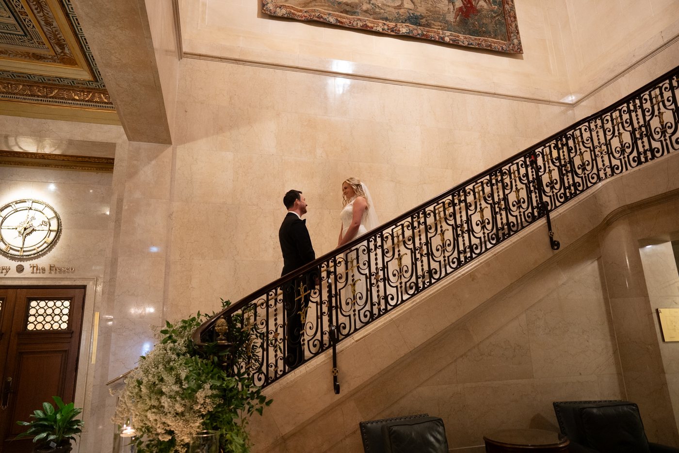 Couple on an ornate staircase, before editing; photograph by Michele Maloney