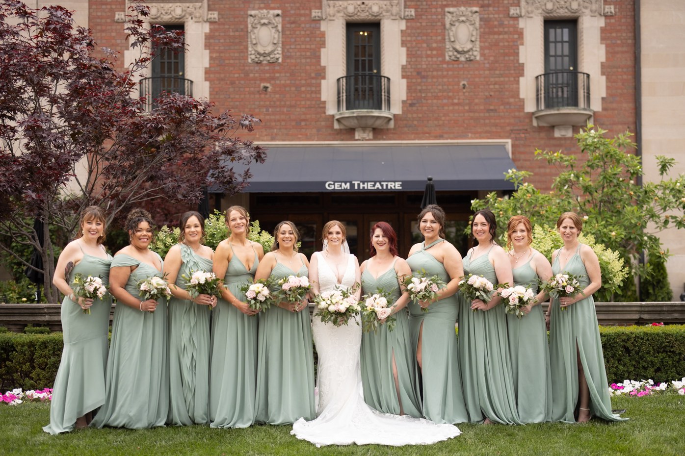 Wedding party in pale green dresses outside a theatre, edited by InPix.Me