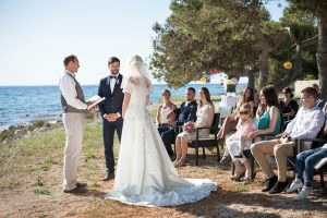 bride and groom at wedding ceremony on beach