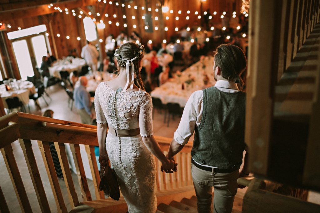 bride and groom walking and holding hands