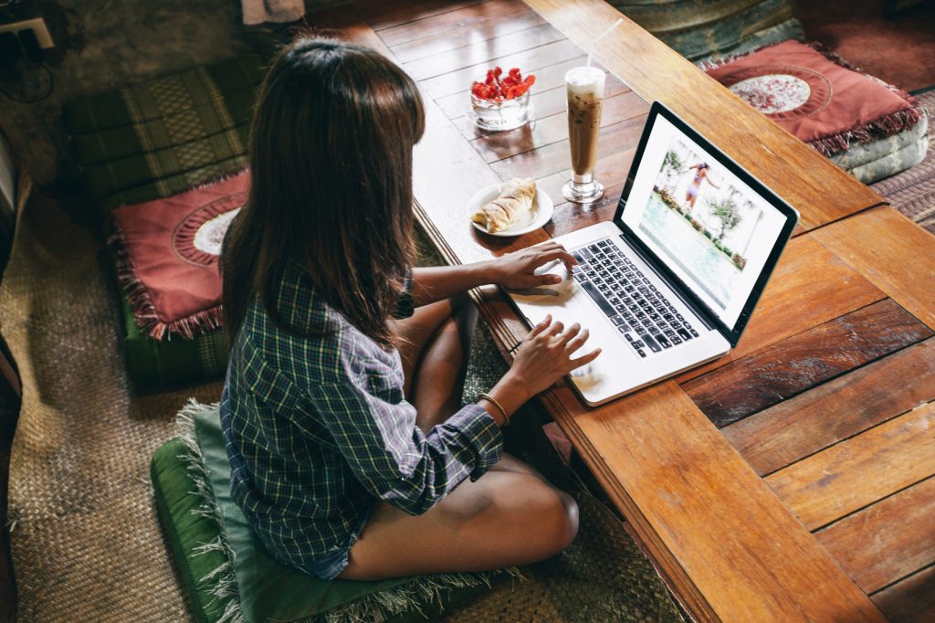woman working with photos on her laptop
