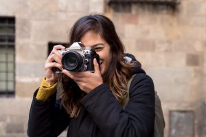 young woman shooting on camera