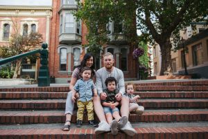 fun loving family of five hanging out together in the city.