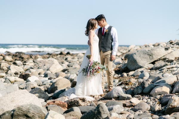 bride and groom at the beach